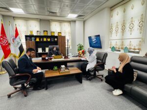 The Dean of the College of Pharmacy discusses with the Student Activities Division the organizational plan for the central graduation ceremony.